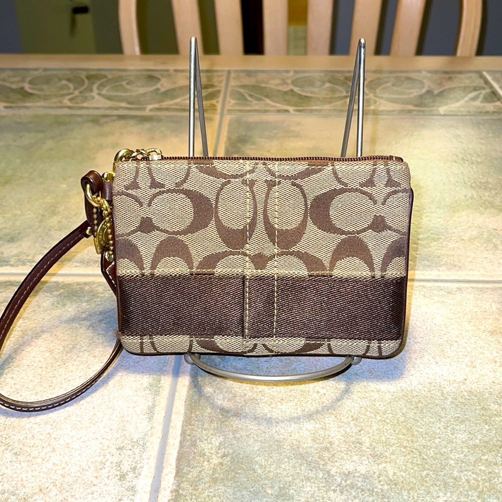 Coach monogrammed brown wallet/wristlet. Excellent used condition.